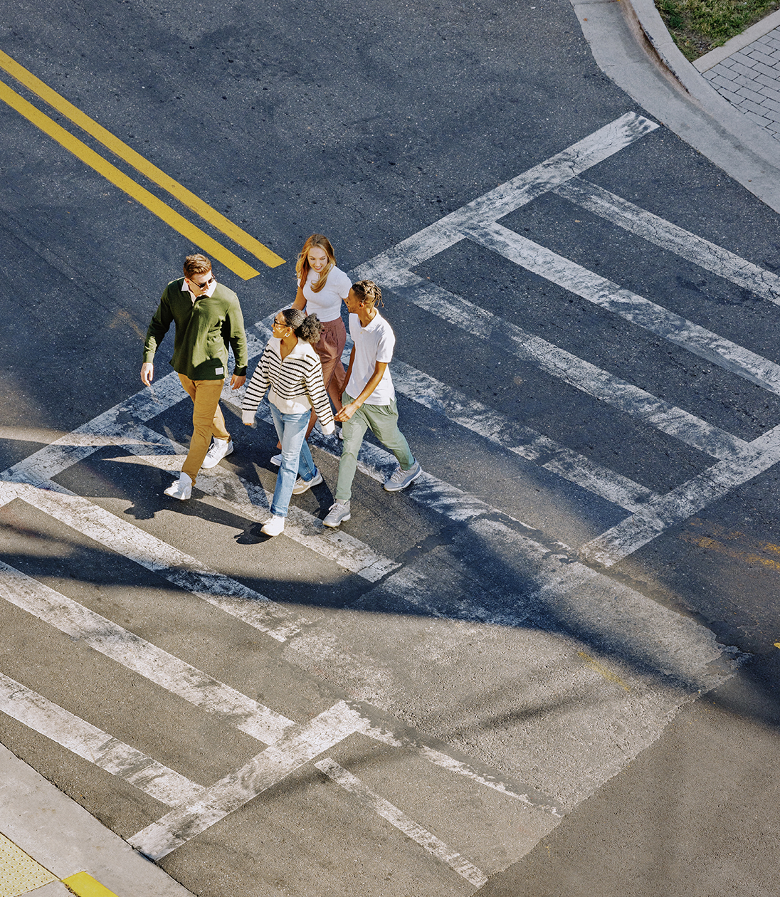 Friends using a crosswalk