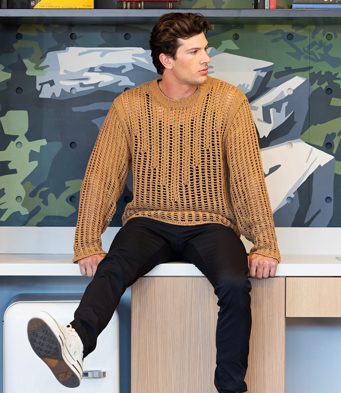 A man sitting on a countertop